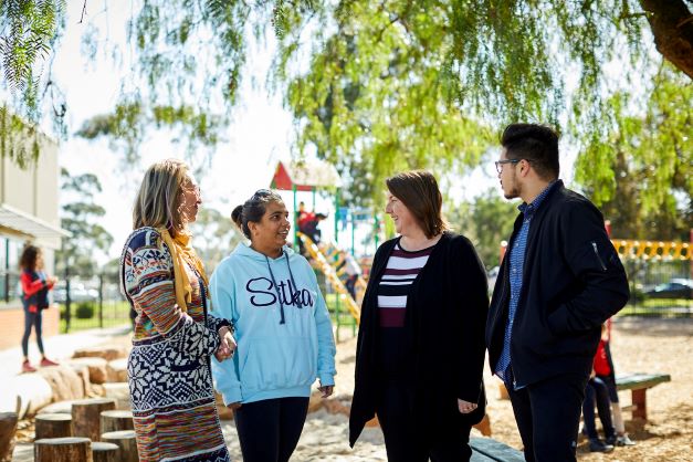 A group of educators in conversation