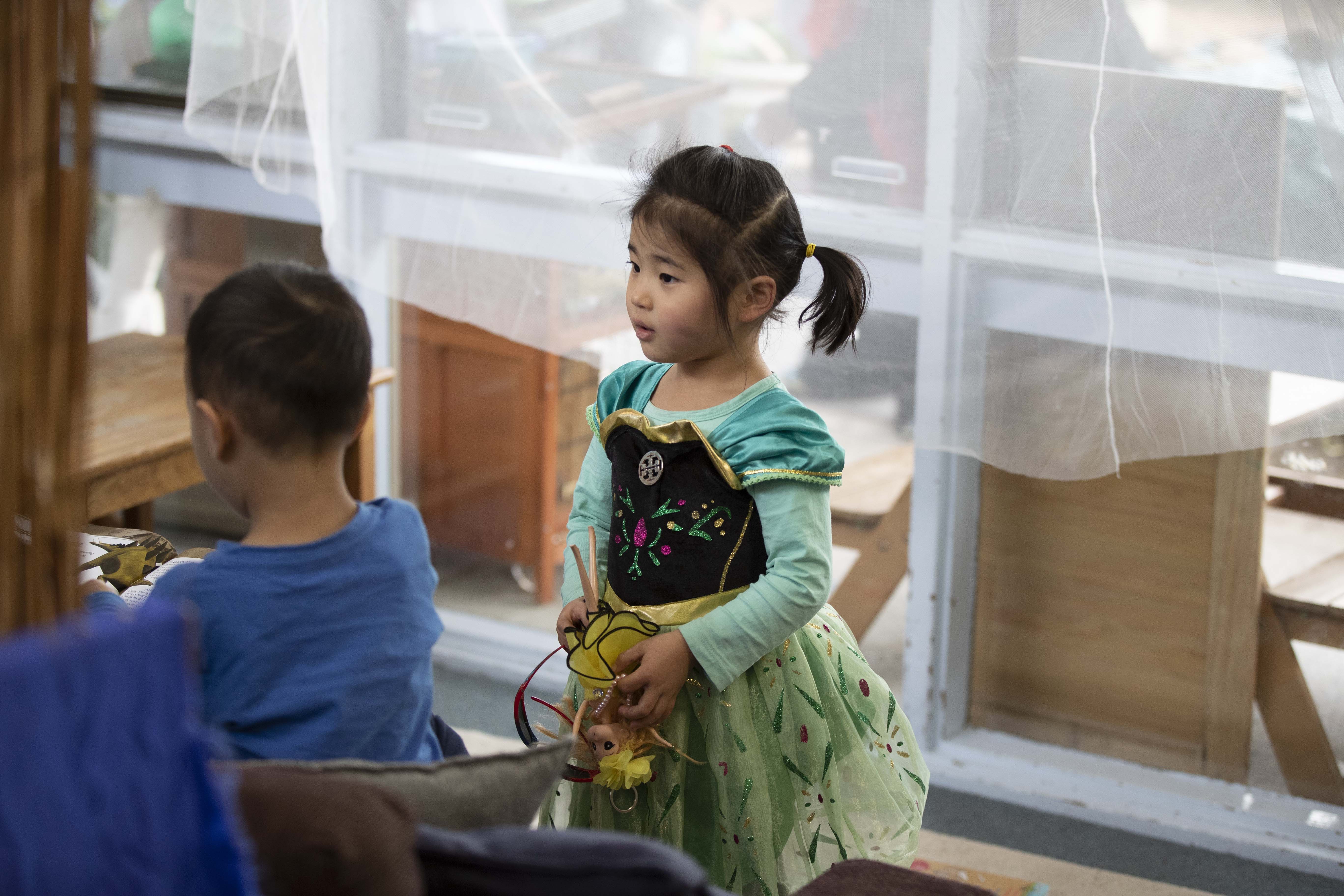 A young child in a costume